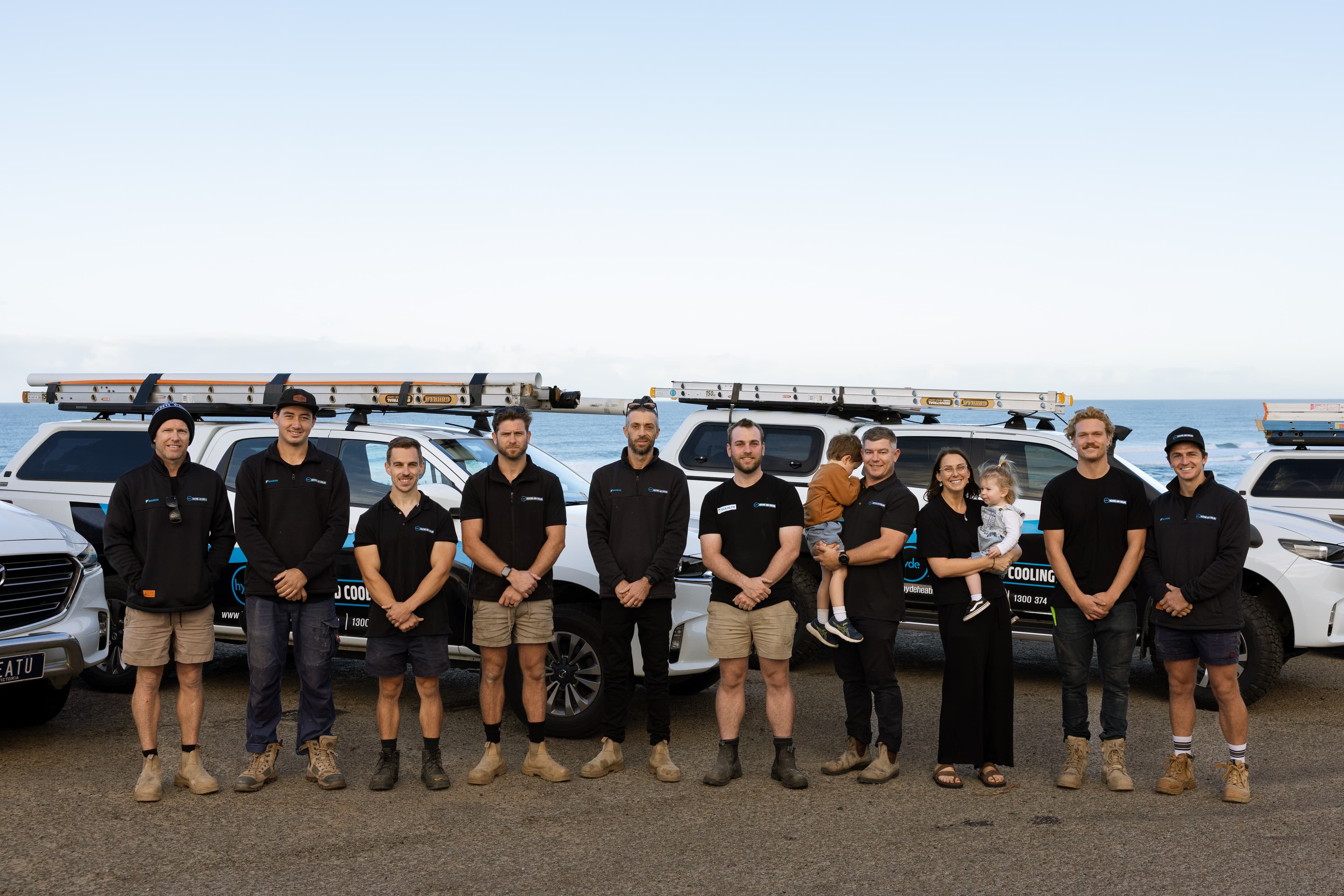 Hyde Heating and Cooling team with family and service vehicles on the Mornington Peninsula